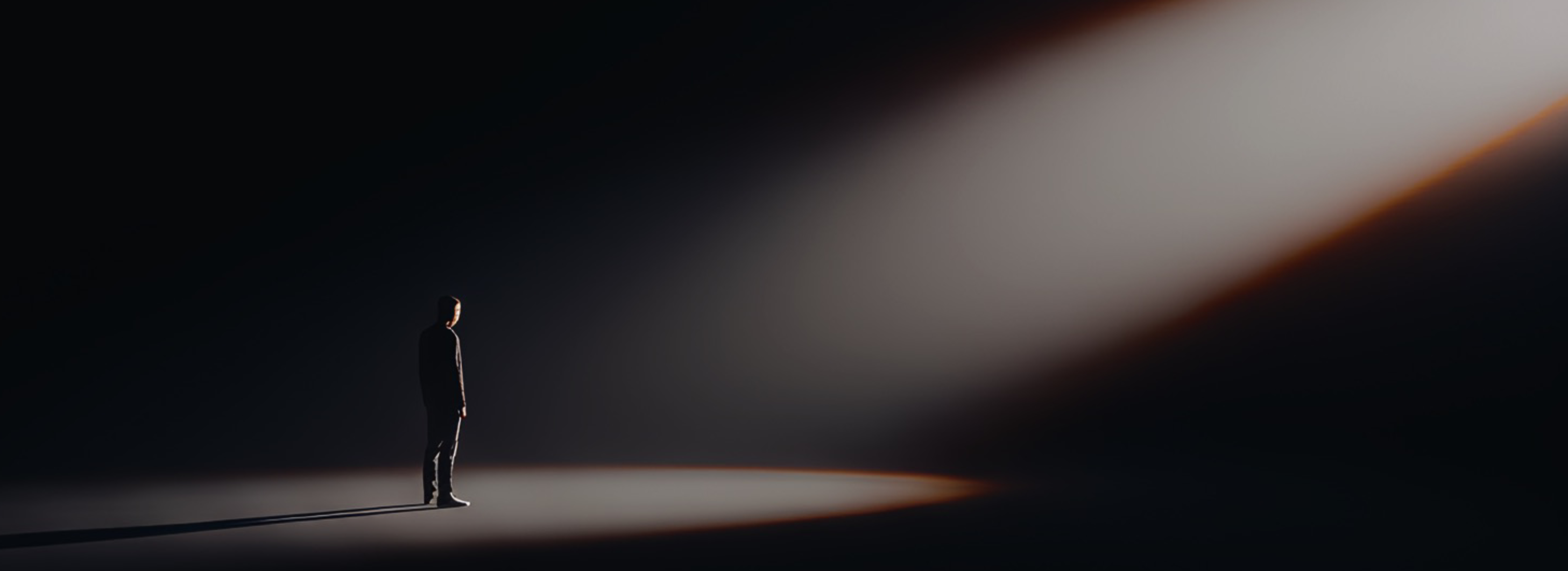 A figure standing in a beam of light